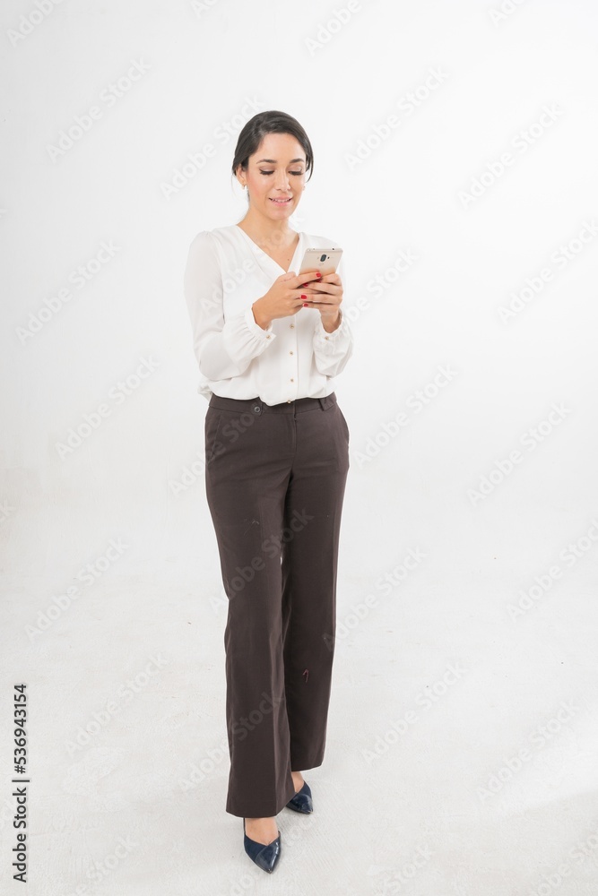 Studio portrait photo of a young beautiful elegant Brazilian female businesswoman lady wearing smart casual business attire posing with a series moments of emotion and gesture of using her smartphone Studio portrait photo of a young beautiful elegant Brazilian female businesswoman lady wearing smart casual business attire posing with a series moments of emotion and gesture of using her smartphone