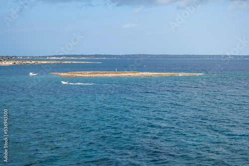 The beautiful Isola Ognina in Syracuse with turquoise and green water