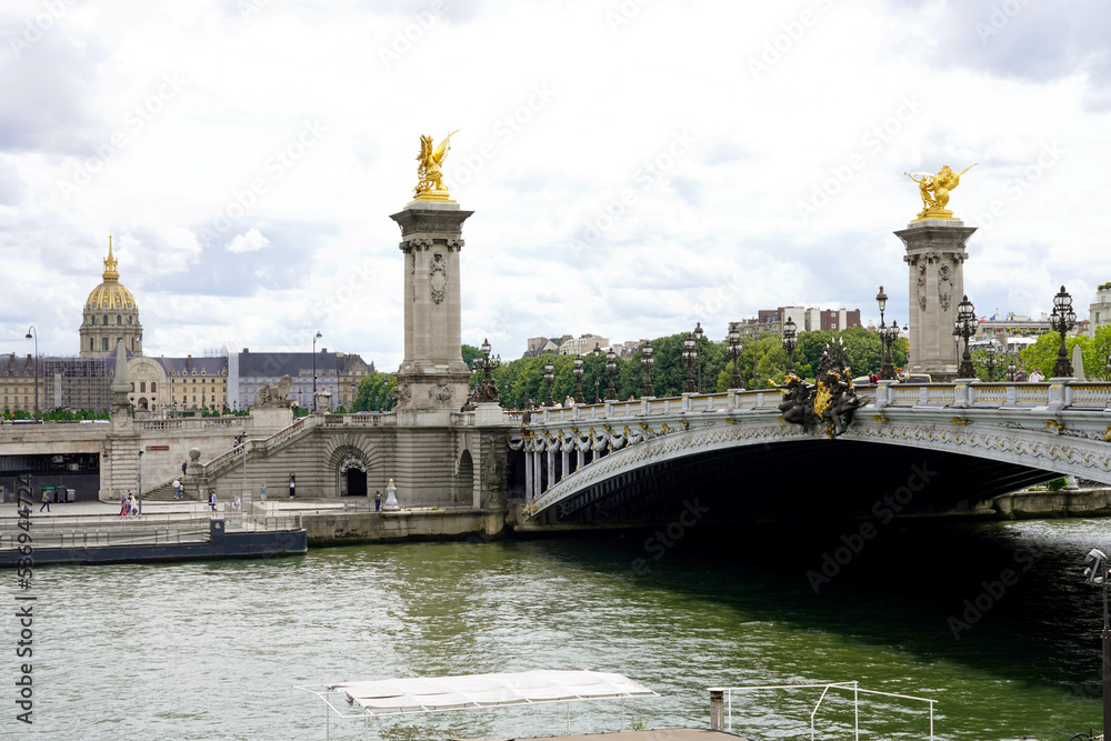 Detail of Pont Alexandre III Bridge with Les Invalides complex buildings on the background