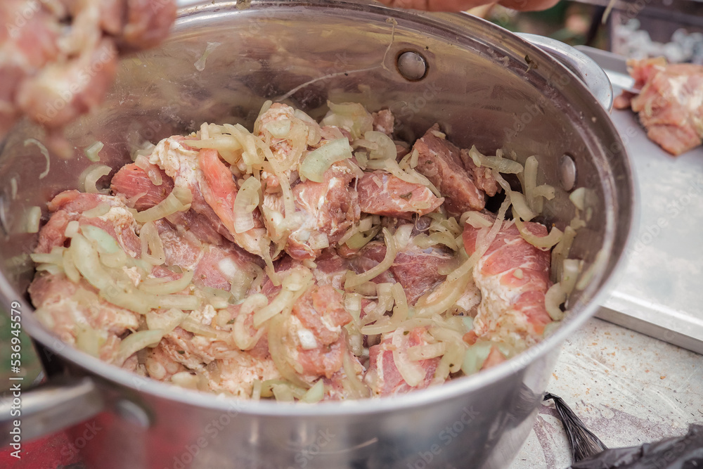 the pickled shish kebab is in a saucepan the pickled shish kebab is in a saucepan