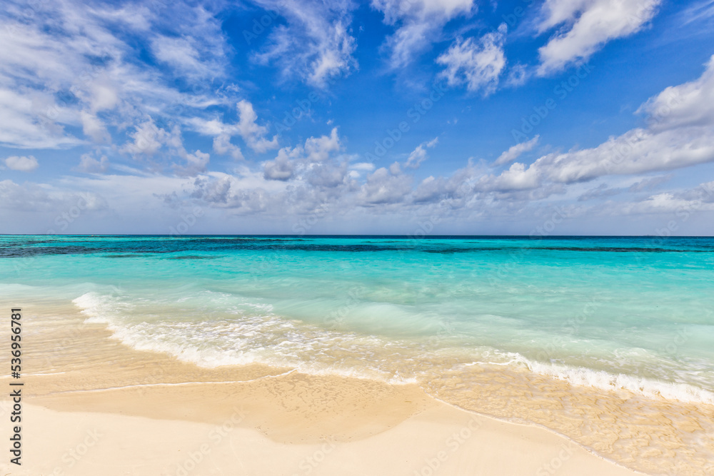 Closeup sand beach sea waves and blue summer sky. Panoramic beach landscape. Empty tropical beach and seascape, horizon. Bright exotic coast calmness, tranquil seaside nature view relaxing sunlight

