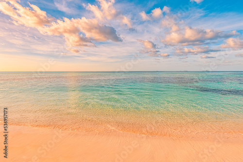 Fototapeta Naklejka Na Ścianę i Meble -  Closeup sea sand beach. Panoramic beach landscape. Inspire tropical beach seascape horizon. Orange and golden sunset sky calmness tranquil relaxing sunlight summer mood. Vacation travel holiday banner