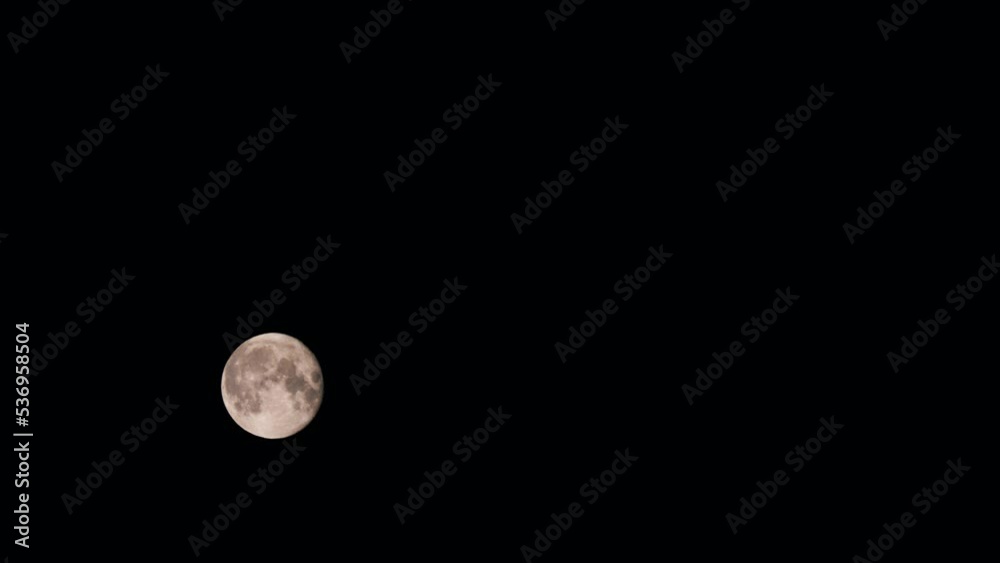 Bottom view of the moon moving in a total black sky. Slow motion Bottom view of the moon moving in a total black sky. Slow motion
