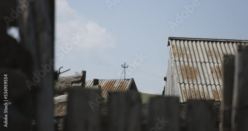 Wallpaper Mural Mysterious shot of rustic dwellings, one with utility pole on the rooftop. Torontodigital.ca