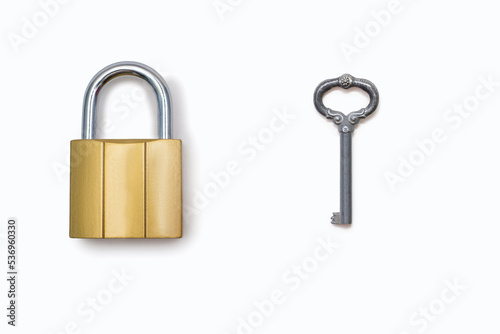 Padlock and antique key on a white background. The concept of protection and protection in the form of a padlock. Free space for text and ads