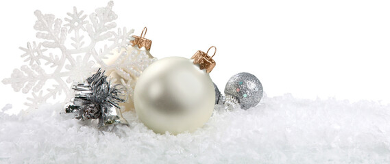 Silver christmas balls over snow isolated on white
