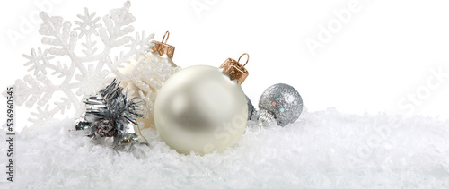 Stampa su tela Silver christmas balls over snow isolated on white