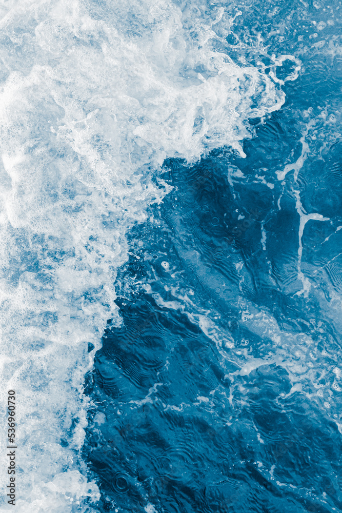 Fototapeta premium Dark blue sea ocean wave and white foam