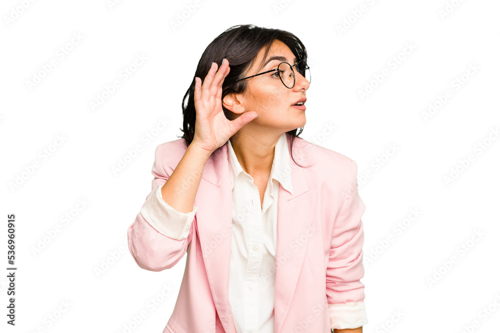 Young Indian business woman wearing a pink suit isolated trying to listening a gossip. Young Indian business woman wearing a pink suit isolated trying to listening a gossip.