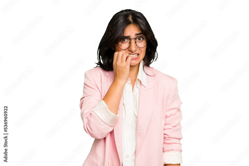 Young Indian business woman wearing a pink suit isolated biting fingernails, nervous and very anxious. Young Indian business woman wearing a pink suit isolated biting fingernails, nervous and very anxious.