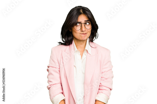 Young Indian business woman wearing a pink suit isolated confused, feels doubtful and unsure.