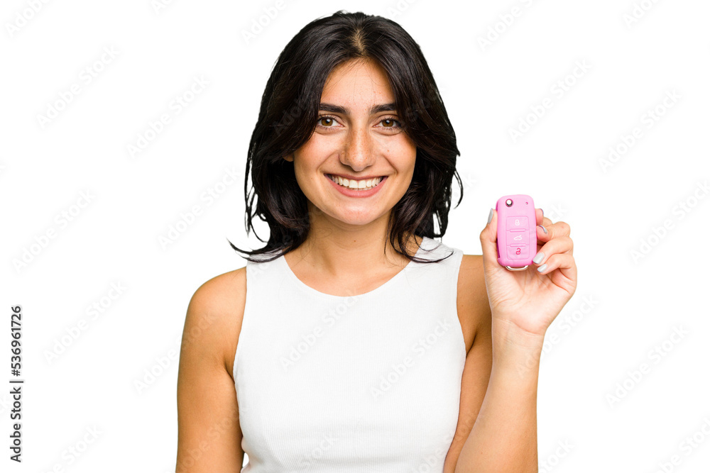 Young Indian woman holding a car keys isolated happy, smiling and cheerful. Young Indian woman holding a car keys isolated happy, smiling and cheerful.