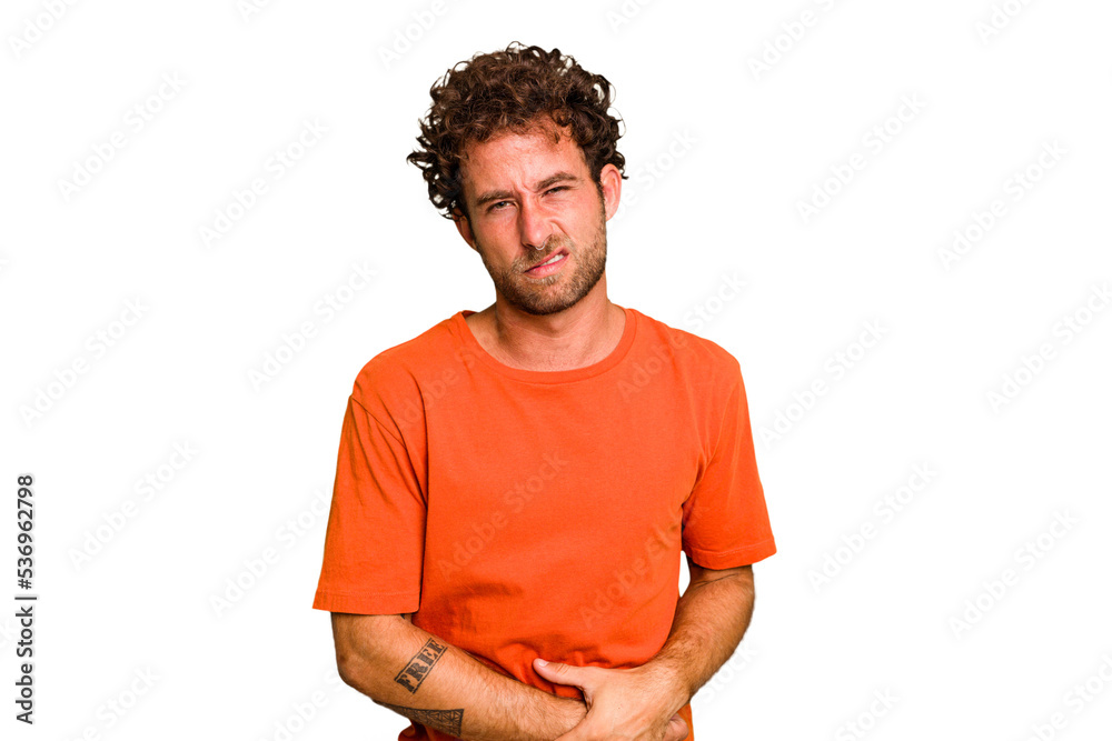 Fototapeta premium Young caucasian curly hair man isolated Young caucasian man with curly hair isolated having a liver pain, stomach ache.