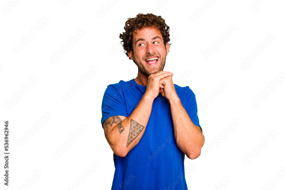 Young caucasian curly hair man isolated Young caucasian man with curly hair isolated praying for luck, amazed and opening mouth looking to front. Young caucasian curly hair man isolated Young caucasian man with curly hair isolated praying for luck, amazed and opening mouth looking to front.