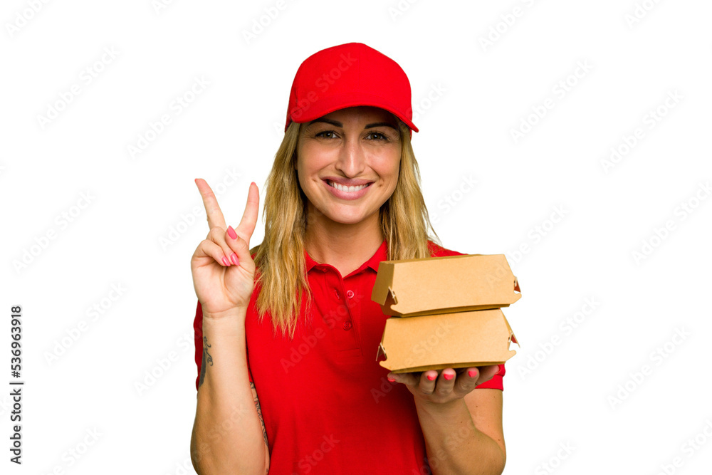 Young caucasian delivery woman holding a burger isolated on green chroma background showing number two with fingers. Young caucasian delivery woman holding a burger isolated on green chroma background showing number two with fingers.