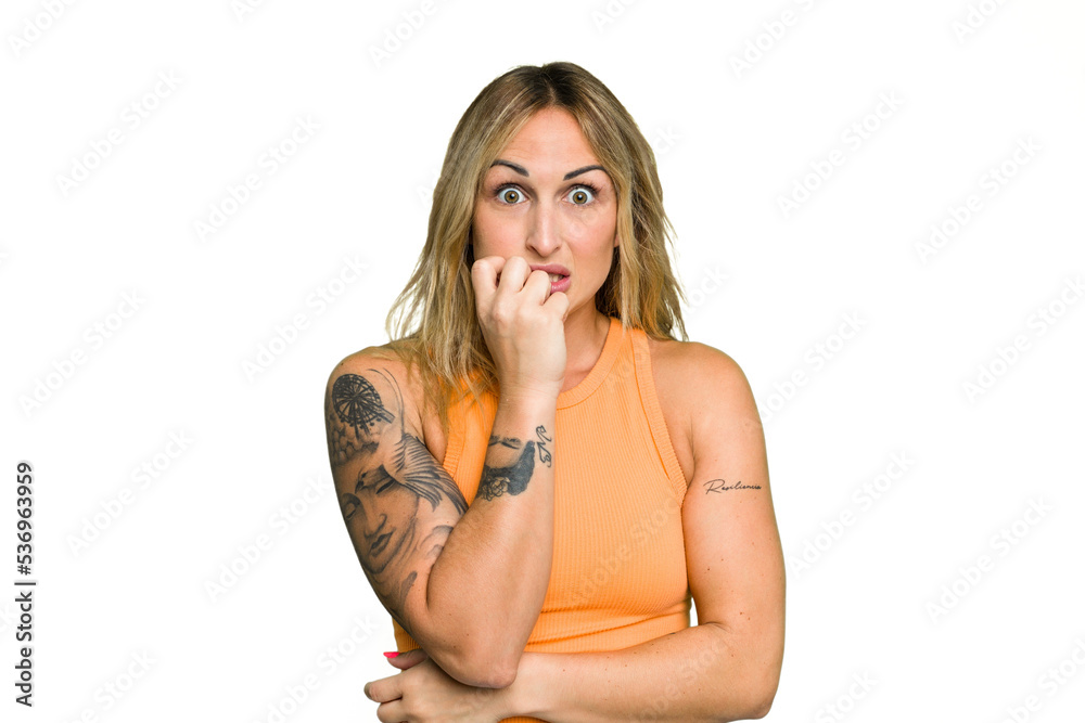 Young caucasian woman isolated on green chroma background biting fingernails, nervous and very anxious. Young caucasian woman isolated on green chroma background biting fingernails, nervous and very anxious.