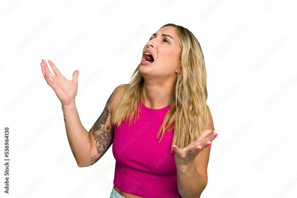 Young caucasian woman isolated on green chroma background screaming to the sky, looking up, frustrated. Young caucasian woman isolated on green chroma background screaming to the sky, looking up, frustrated.
