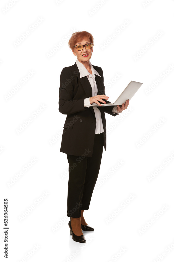 Portrait of confident senior executive manager. Stylish middle age woman in black business suit posing isolated on white background