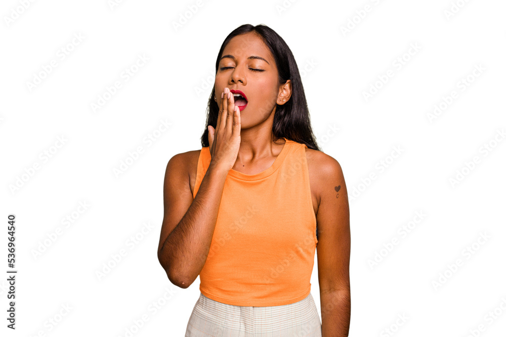 Young Indian woman isolated yawning showing a tired gesture covering mouth with hand. Young Indian woman isolated yawning showing a tired gesture covering mouth with hand.