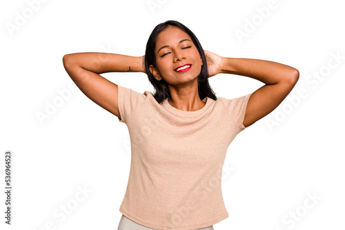 Young Indian woman isolated stretching arms, relaxed position.