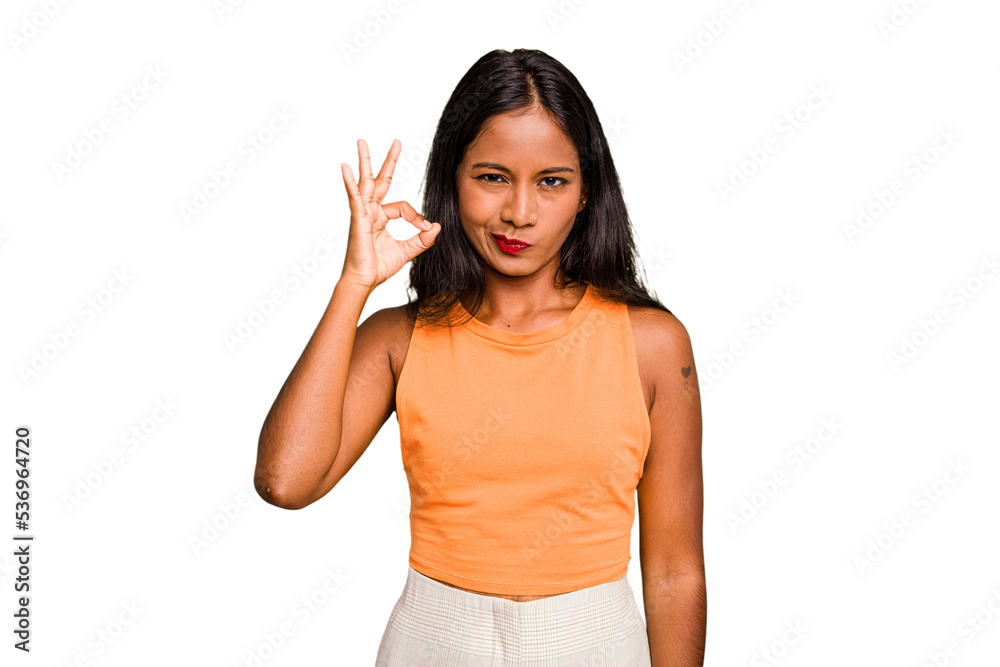 Young Indian woman isolated with fingers on lips keeping a secret. Young Indian woman isolated with fingers on lips keeping a secret.