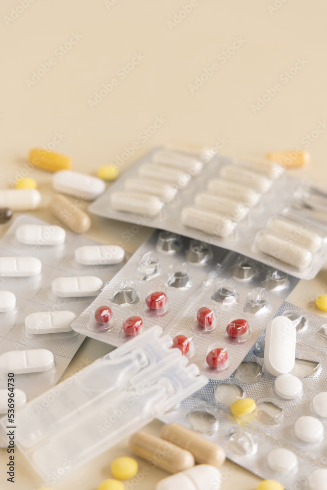 Mix of pills and capsules in a used plastic blisters close up, copy space. Dietary supplements Mix of pills and capsules in a used plastic blisters close up, copy space. Dietary supplements