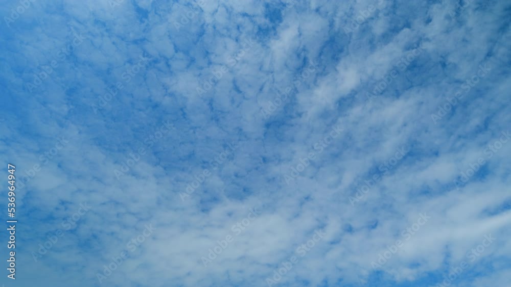 White and gray clouds fly across the sky and change shape. Clearing day and good windy weather. Time lapse. White and gray clouds fly across the sky and change shape. Clearing day and good windy weather. Time lapse.