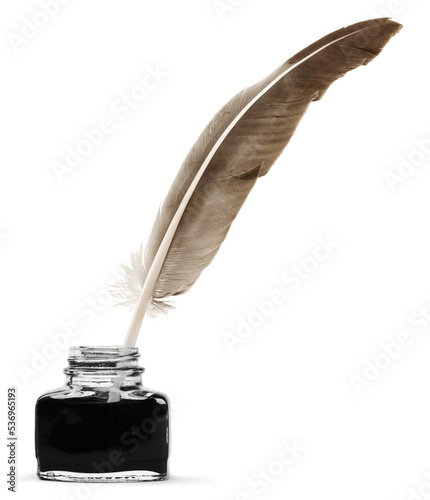 Feather quill pen and glass inkwell isolated on a white background photo