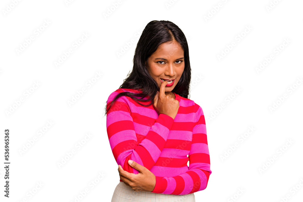 Young Indian woman isolated relaxed thinking about something looking at a copy space. Young Indian woman isolated relaxed thinking about something looking at a copy space.