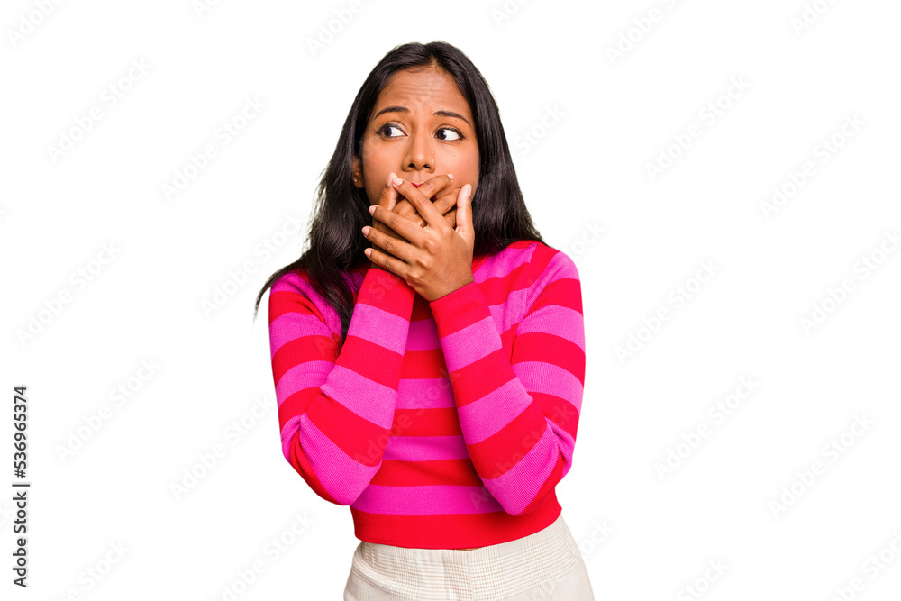 Young Indian woman isolated thoughtful looking to a copy space covering mouth with hand. Young Indian woman isolated thoughtful looking to a copy space covering mouth with hand.
