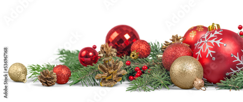 Christmas decorations with tree branches and baubles isolated on white background