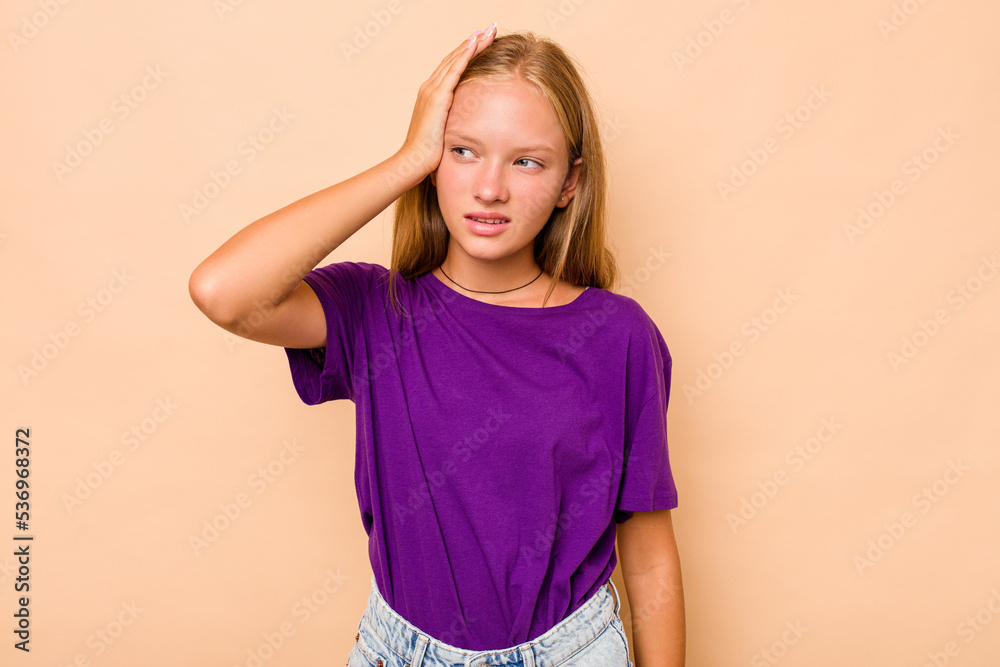Caucasian teen girl isolated on beige background being shocked, she has remembered important meeting. Caucasian teen girl isolated on beige background being shocked, she has remembered important meeting.