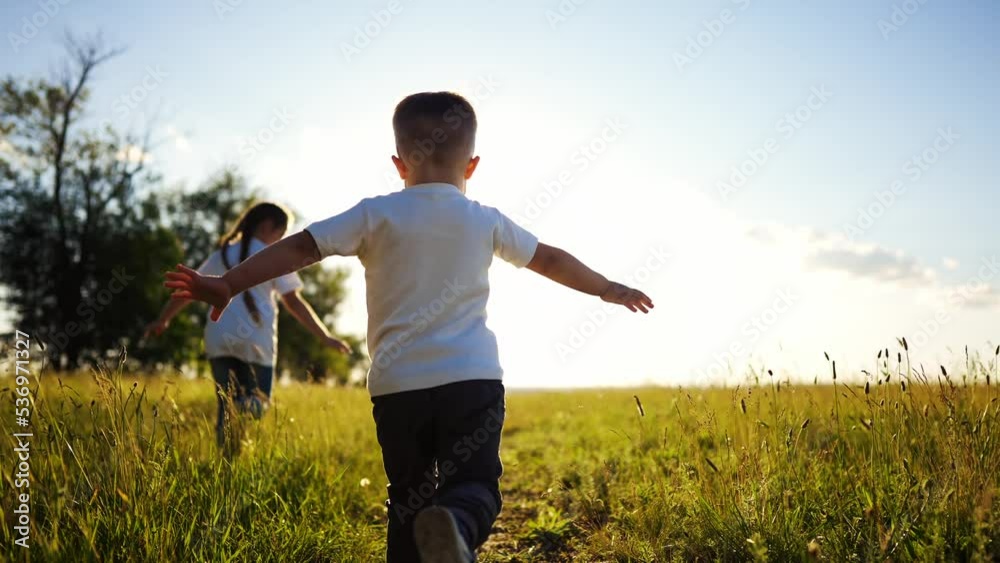 happy family kids. people in the park children child running together in the park at sunset silhouette. mom dad daughter and son are run happy family and little child in summer. fun dream kids run happy family kids. people in the park children child running together in the park at sunset silhouette. mom dad daughter and son are run happy family and little child in summer. fun dream kids run