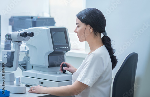 an optometrist checks his eyesight with a slit lamp. The concept of biomicroscopy of the eye