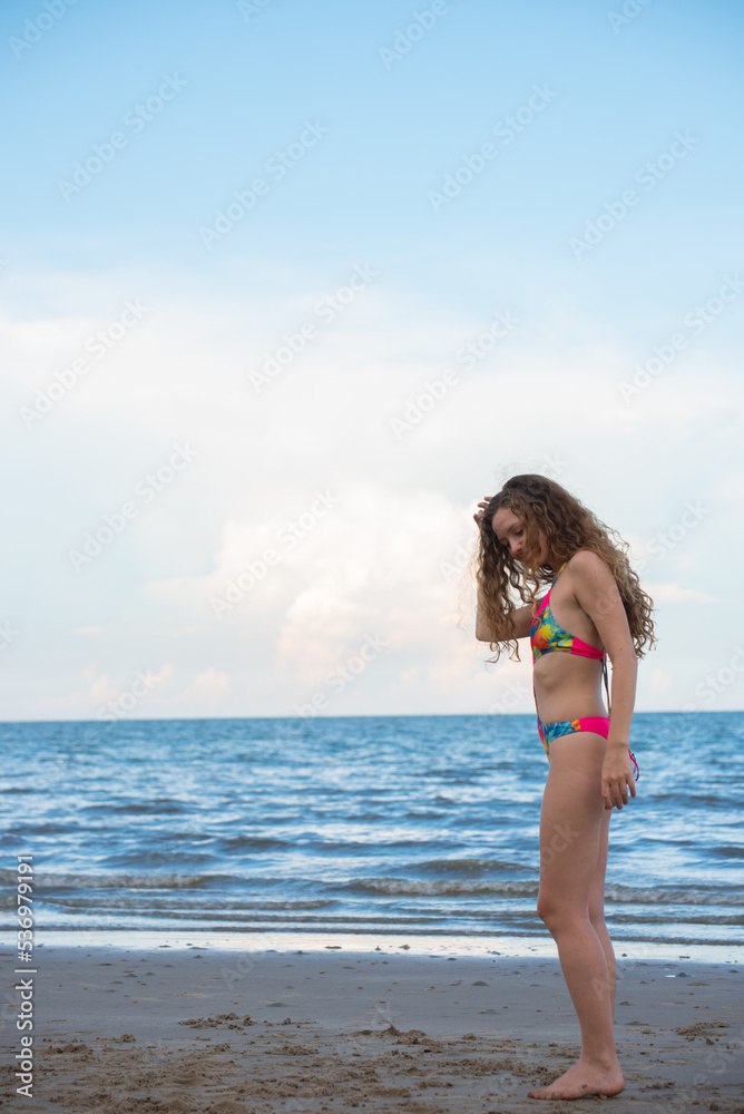 Naklejka premium Portrait beautiful woman with bikini on the beach. Holiday and summer travel concept.