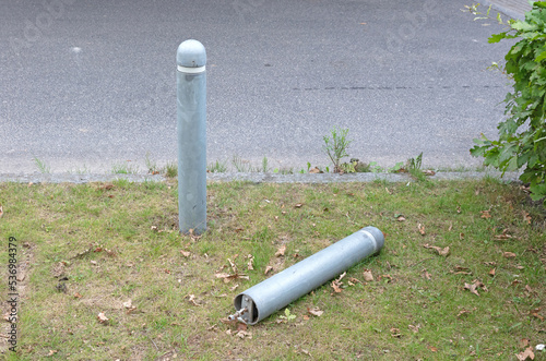 Pole at the side of a asphalt road