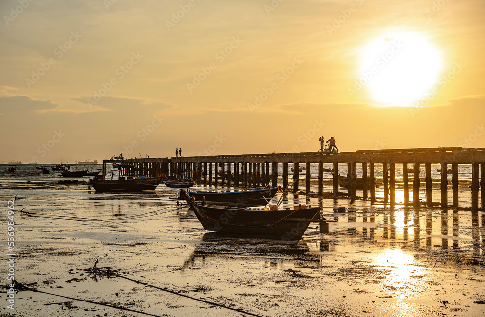 Evening at sunset around the fish bridge, the local fishing port, Bang Phra, Chonburi province, Thailand.