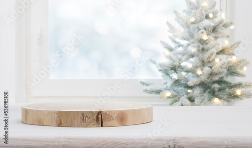 Christmas background with wooden table and podium for product presentation