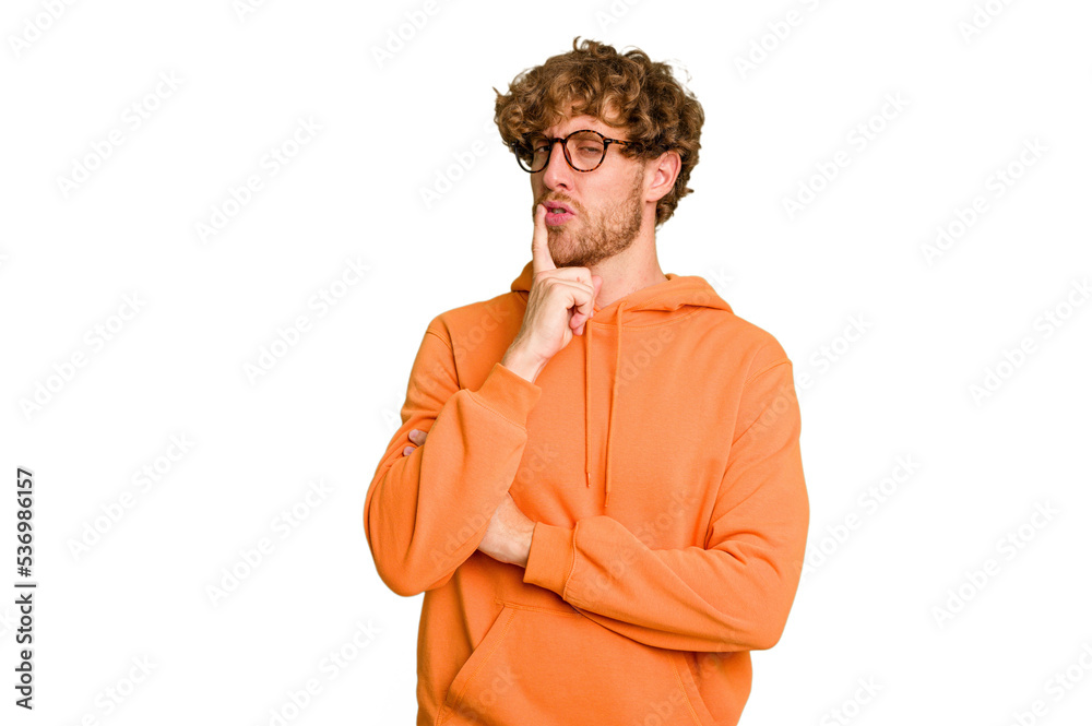 Young caucasian man isolated on green chroma background looking sideways with doubtful and skeptical expression. Young caucasian man isolated on green chroma background looking sideways with doubtful and skeptical expression.