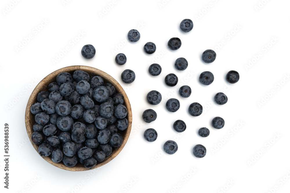 blueberries in wooden bowl isolated on white blueberries in wooden bowl isolated on white