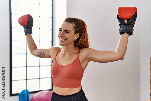 Young redhead woman smiling confident boxing at sport center © Krakenimages.com