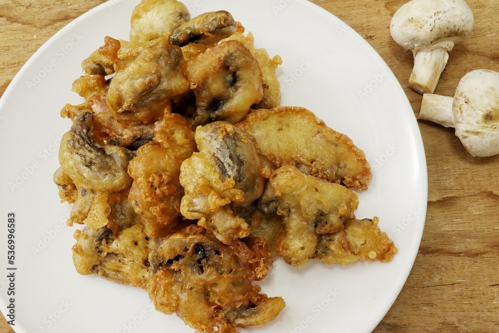 Champignon mushrooms in breadcrumbs or deep fried mushrooms Champignon mushrooms in breadcrumbs or deep fried mushrooms