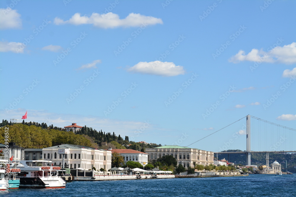 Istanbul water view, mansion, boats, sky and clouds