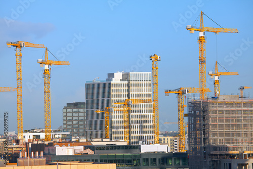 Construction with cranes of modern city . Crane machinery in contemporary city 