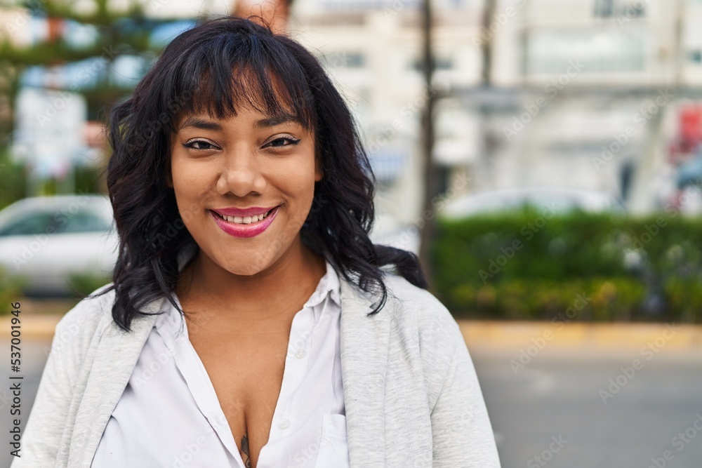 Young beautiful latin woman smiling confident standing at street Young beautiful latin woman smiling confident standing at street