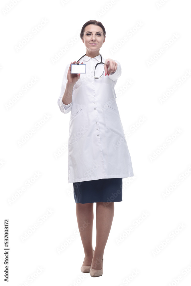 in full growth. female doctor showing her visiting card. in full growth. female doctor showing her visiting card.