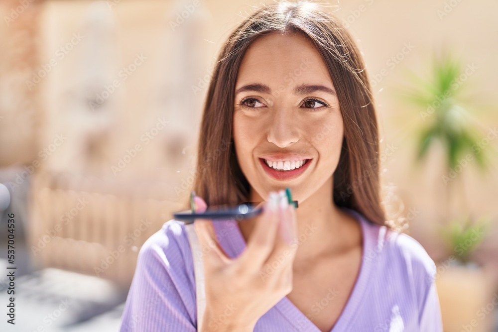 Young beautiful hispanic woman smiling confident talking on the smartphone at street Young beautiful hispanic woman smiling confident talking on the smartphone at street