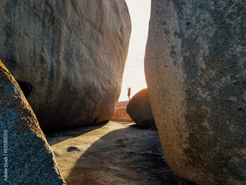 Person Standing in Gap of Remarkable Rocks