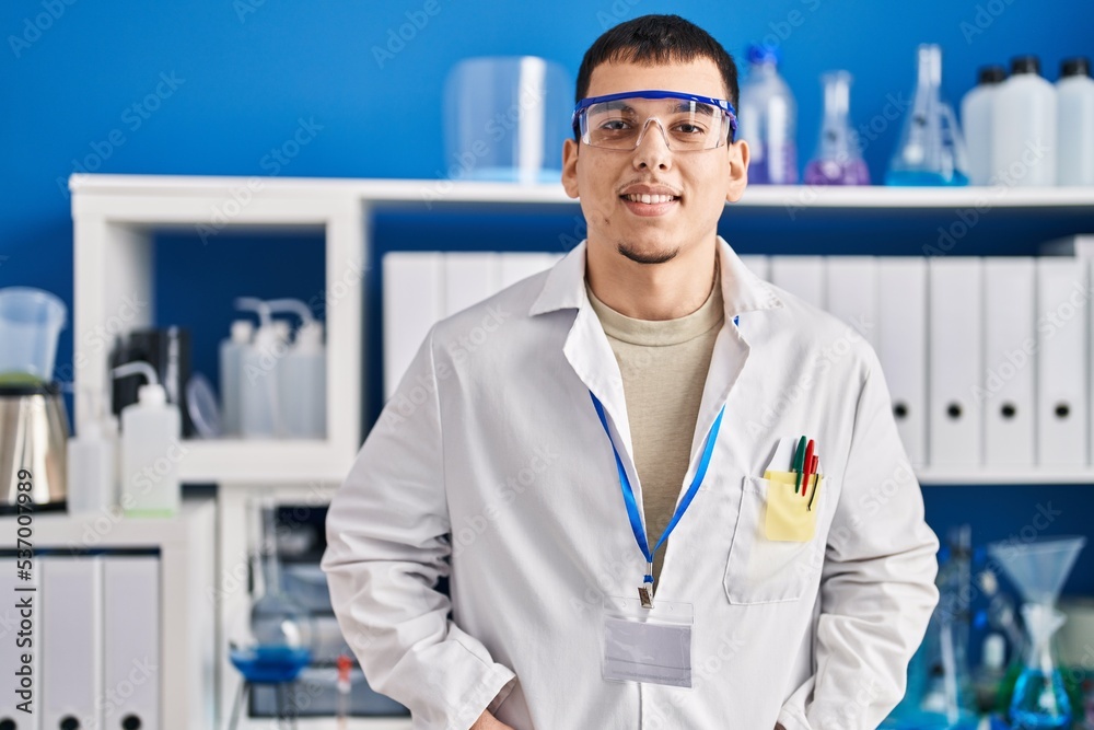 Young man scientist smiling confident at laboratory Young man scientist smiling confident at laboratory
