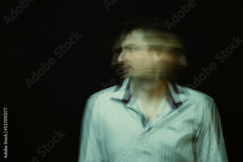 schizophrenic abstract blurry portrait of man with mental disorders and mental illnesses on dark background